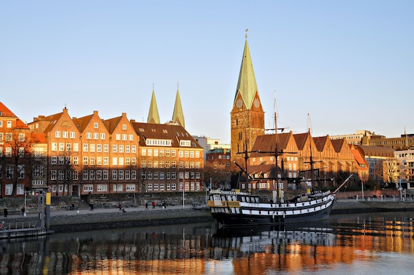 BREMEN, GERMANY – MARCH 6, 2011: The city at the shore berth old sailing ship.